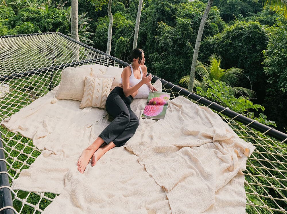 Women finding balance through emotional intelligence practices at a serene Bali retreat, surrounded by nature and calm energy.