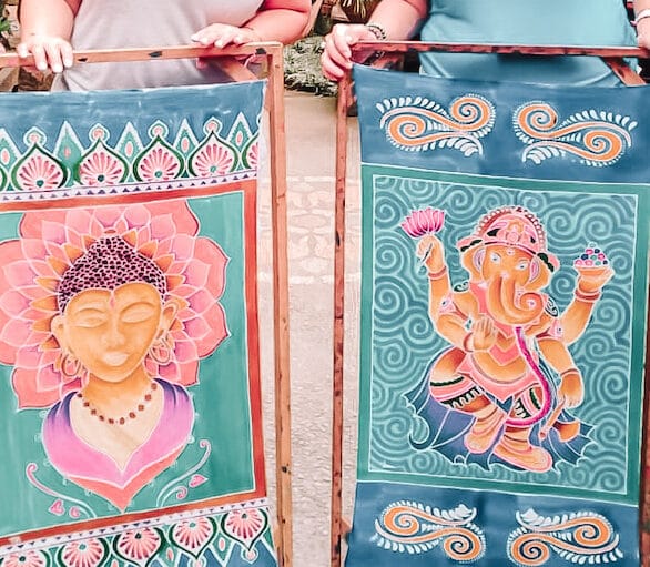 Women creating art in Bali retreat batik workshop