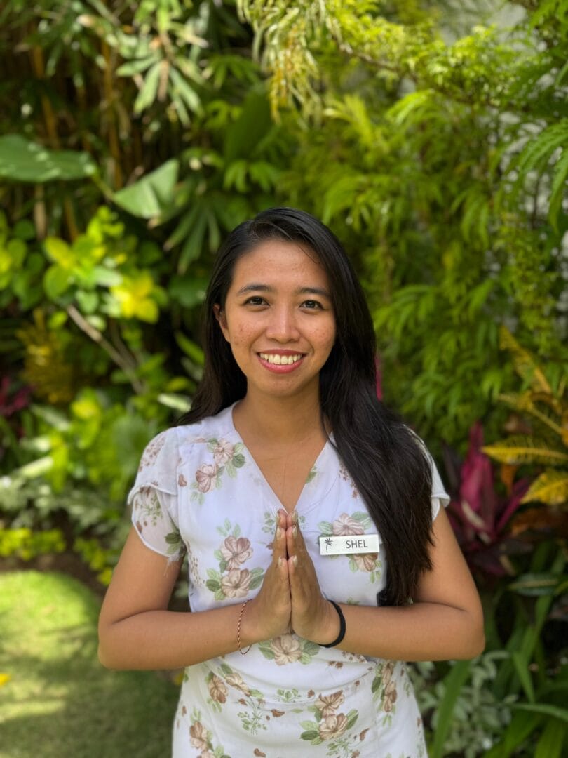 Shel, hostess at Ubud retreat, staff member smiling and welcoming guests.